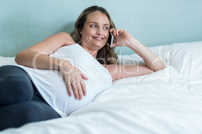 Pregnant woman making a phone call