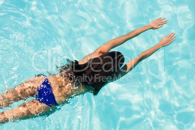 Fit woman swimming in the pool