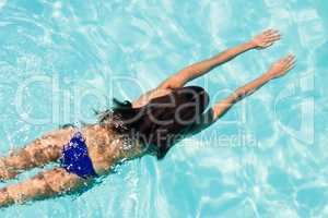 Fit woman swimming in the pool