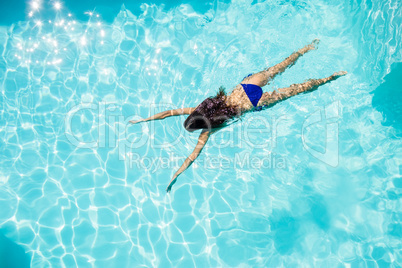 Fit woman swimming in the pool