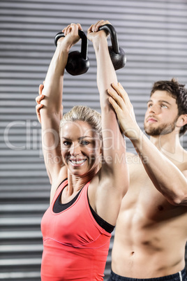 Couple exercising with dumbbells