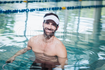 Smiling man doing underwater bike