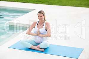 Pregnant woman doing yoga