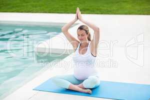 Pregnant woman doing yoga