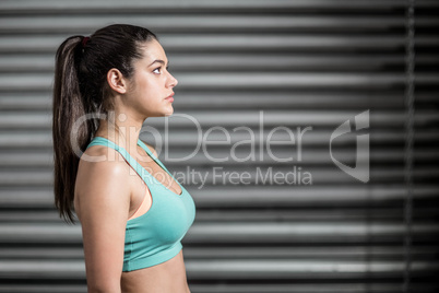 Portrait of fit woman looking up