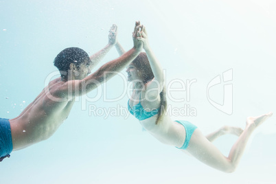 Smiling couple under water