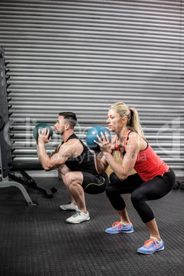 Couple doing ball exercise