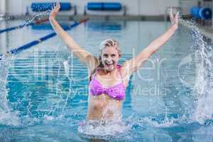 Pretty woman doing aqua aerobics