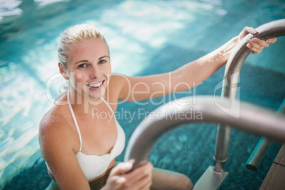 Attractive woman getting out of the water