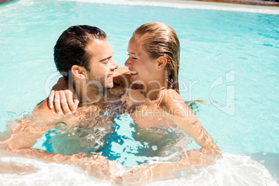 Happy couple in the pool