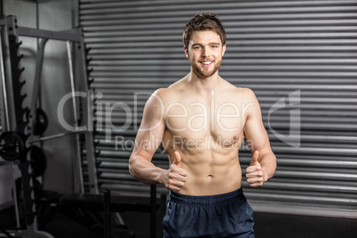 Shirtless fit man thumbs up