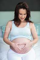 Pregnant woman touching her belly