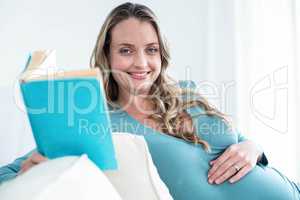 Pregnant woman reading a book