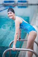 Pretty woman wearing swim cap
