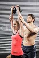 Couple exercising with dumbbells