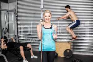 Fit woman holding barbell