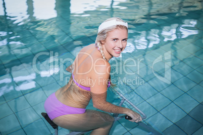 Fit woman doing underwater bike