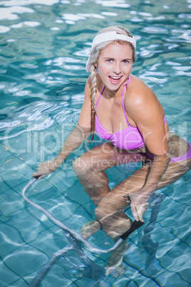 Fit woman doing underwater bike