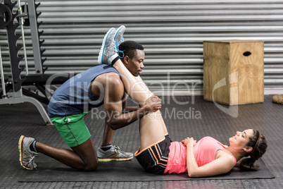 Fit couple doing exercises