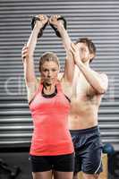 Couple exercising with dumbbells