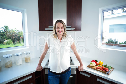 Pregnant woman smiling at camera