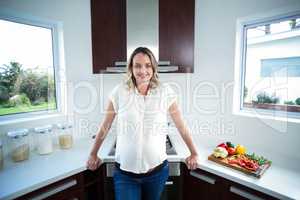 Pregnant woman smiling at camera