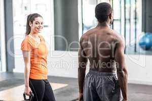 Athletic man and woman working out