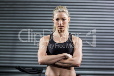 Fit woman posing with crossed arms