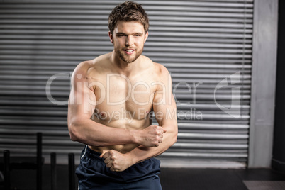 Shirtless man showing his muscle