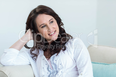 Pregnant woman sitting in the living room