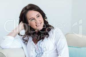 Pregnant woman sitting in the living room