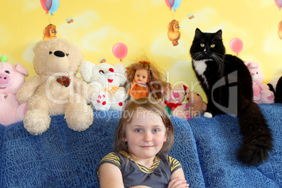 little girl and her cat in the children's room