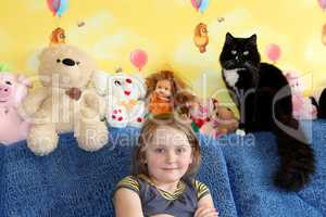 little girl and her cat in the children's room