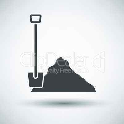 Construction shovel and sand icon