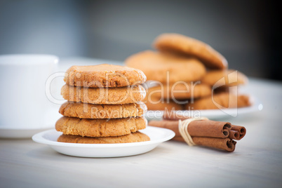 Fresh baked peanut butter cookies with cinamon sticks