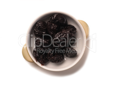 Dried plums in a bowl