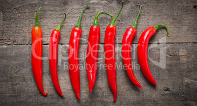 Red chilies on wood