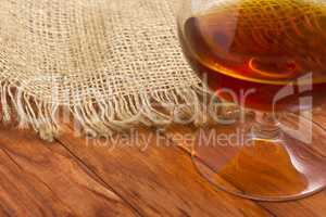 Cognac in glass on the wood