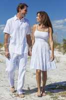 Middle Aged Couple Walking on An Empty Beach