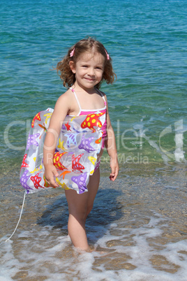 happy little girl with airbed