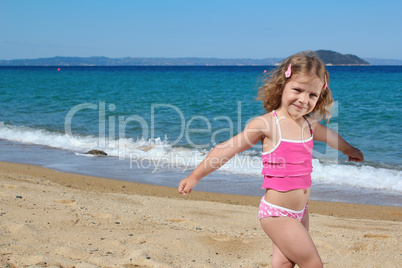 young girl posing on the beach