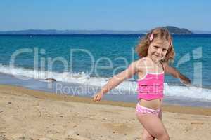 young girl posing on the beach