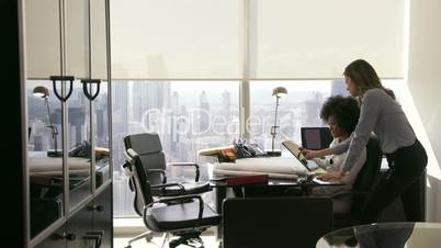 1 Female Colleagues Architect Using Tablet PC In Office