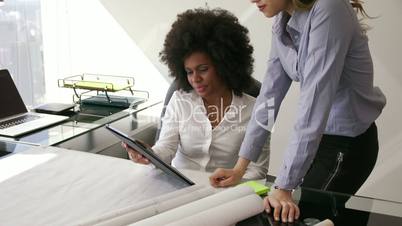 3 Women Colleagues Architect With Tablet PC And Blueprints