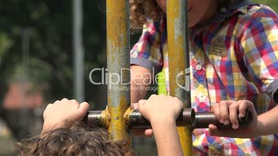 Young Brothers Playing at Playground