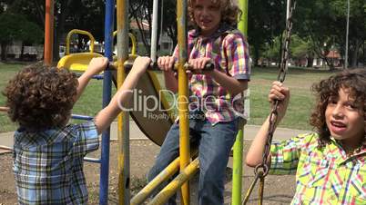 Brothers Playing on Swing Set