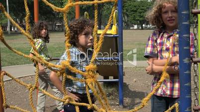 Boys Climbing Ropes at Playground