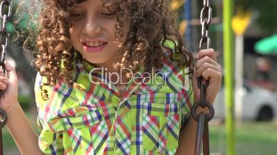 Mentally Disabled Boy on Swing Set