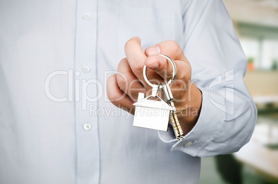 Estate agent holding keys to new house