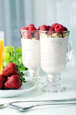 Glass of dessert with fresh berries, muesli and yoghurt